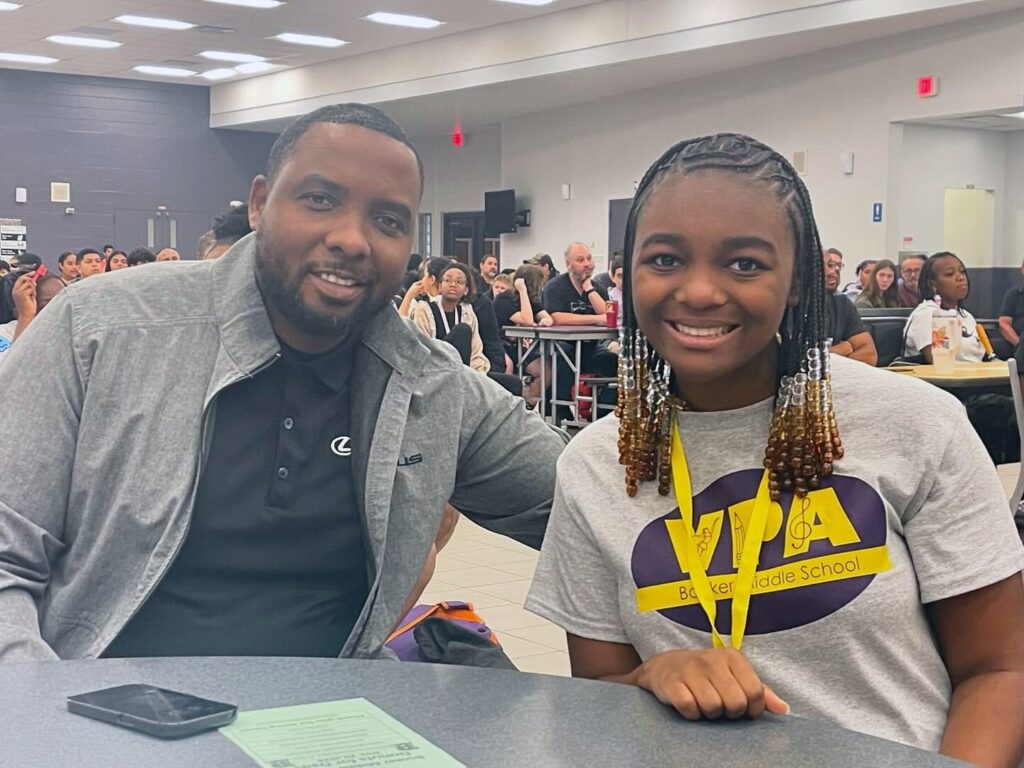 Father and daughter at a school function
